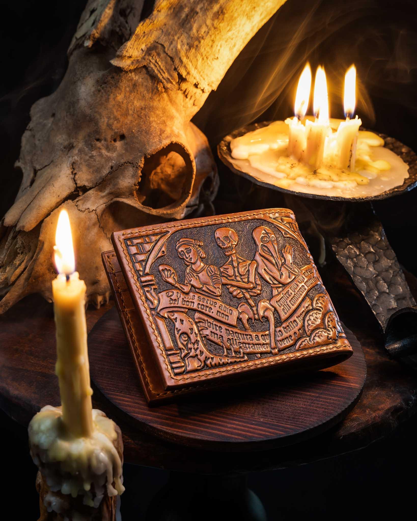 Back view of the handmade leather wallet, showcasing continuous hand-tooled skeletal figures inspired by historical medieval art.