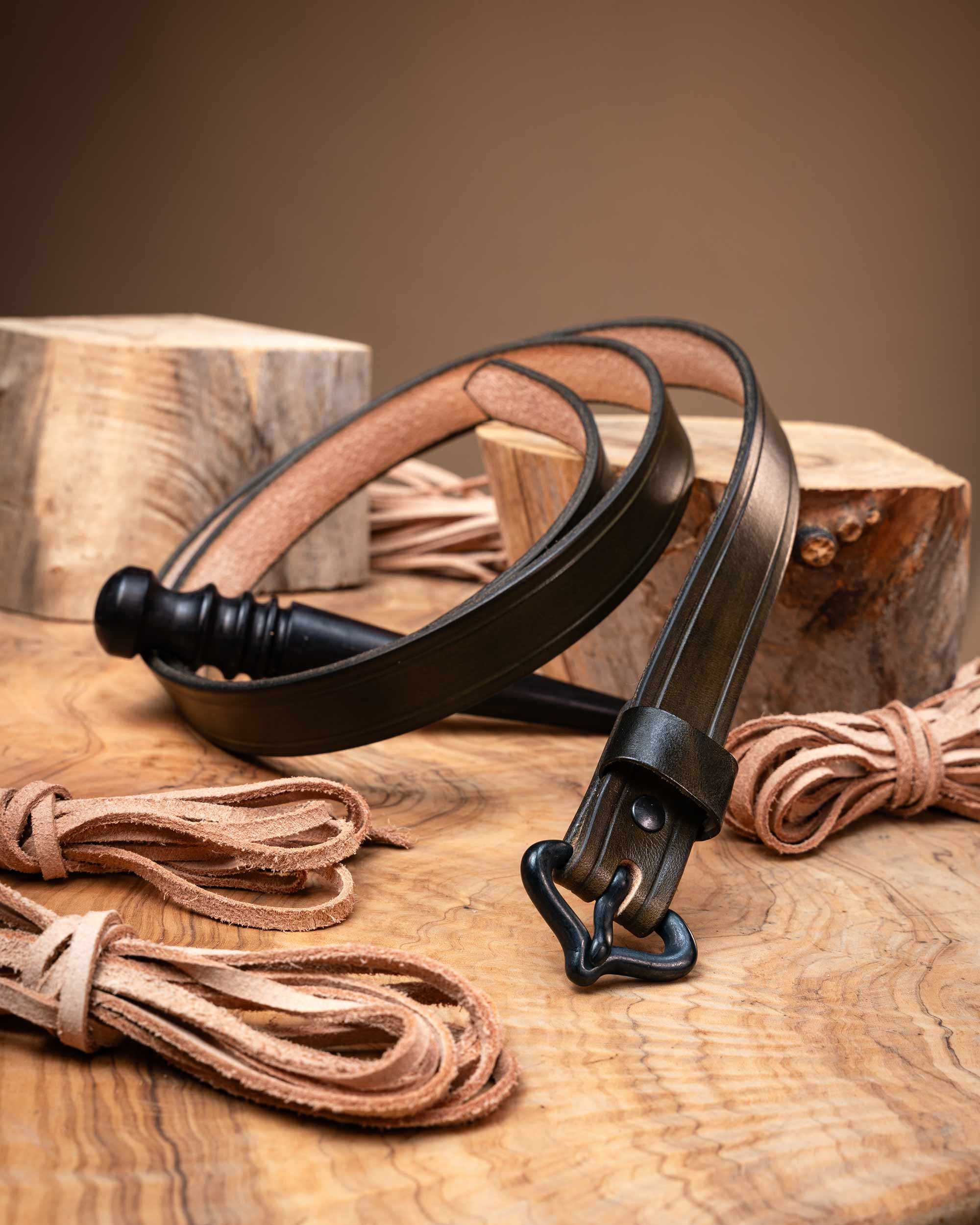 Olive green handcrafted leather belt designed for medieval outfits, featuring a period-accurate black buckle and smooth finished edges.