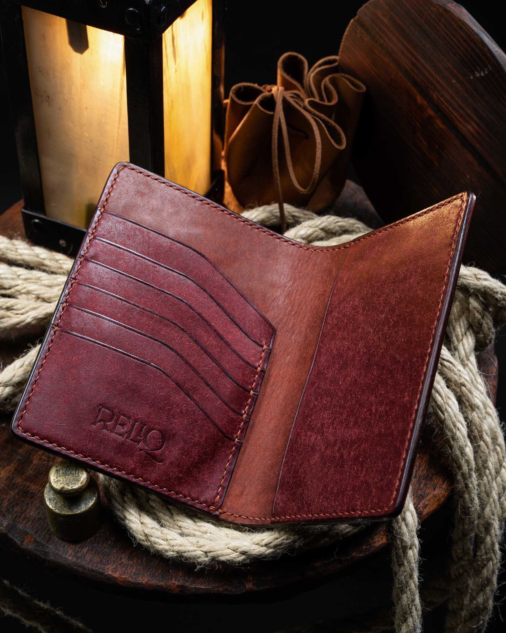 Fully opened medieval leather passport cover showcasing the functional internal layout, featuring a dedicated passport compartment and hand-stitched credit card slots.