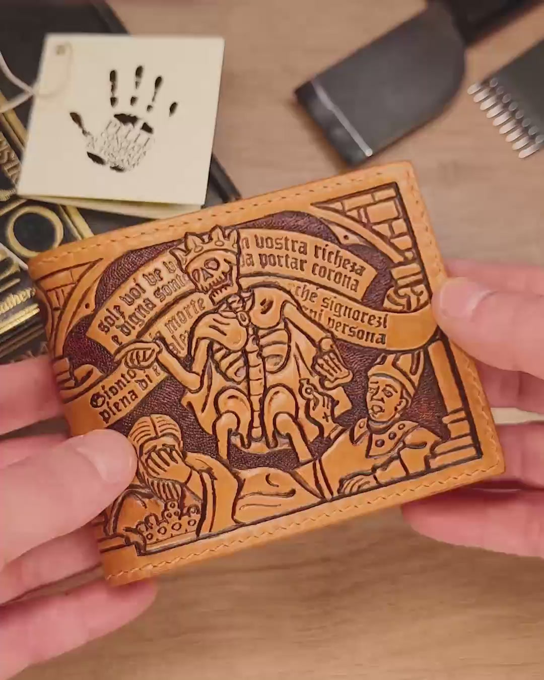 Detailed close-up of the 'Triumph of Death' handmade leather wallet by Reliq, featuring intricate medieval-style skeleton tooling on Italian vegetable-tanned leather, demonstrating craftsmanship and card functionality