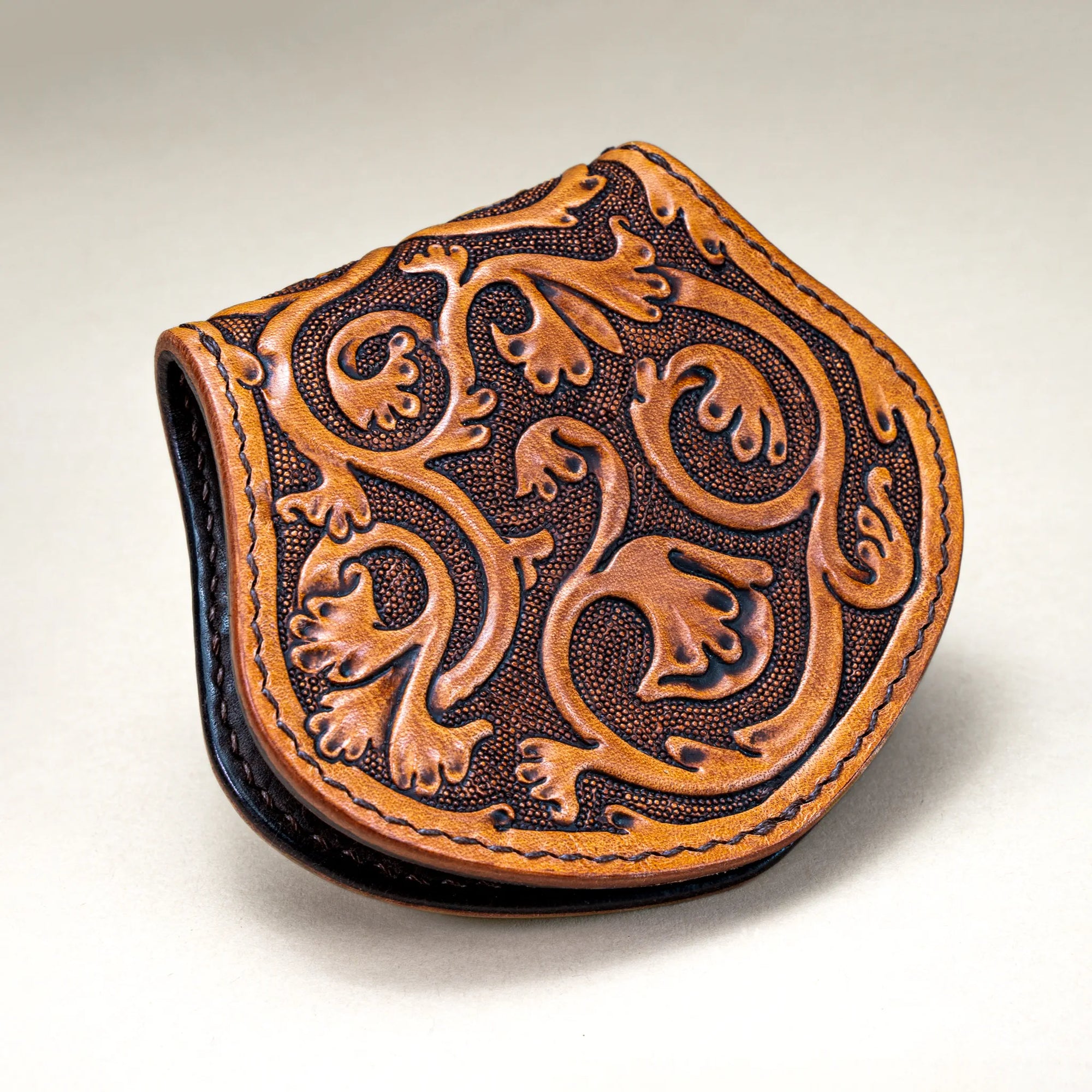 Back view of Reliq Leather Gryphon handmade coin purse with Gothic floral tooling inspired by medieval manuscripts.