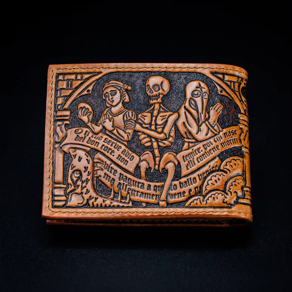 Back view of a handmade brown leather wallet showing a detailed Danse Macabre hand-tooled marginalia with a skeleton, hell door, medieval maiden and praising monk.