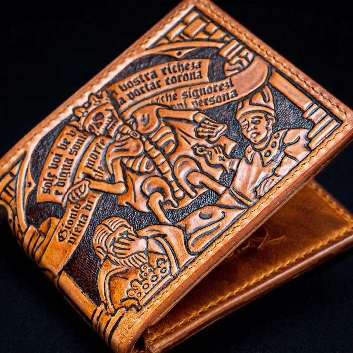 Hand-tooled vegetable-tanned leather bifold wallet featuring a medieval Triumph of Death carving with a skeleton queen and king.