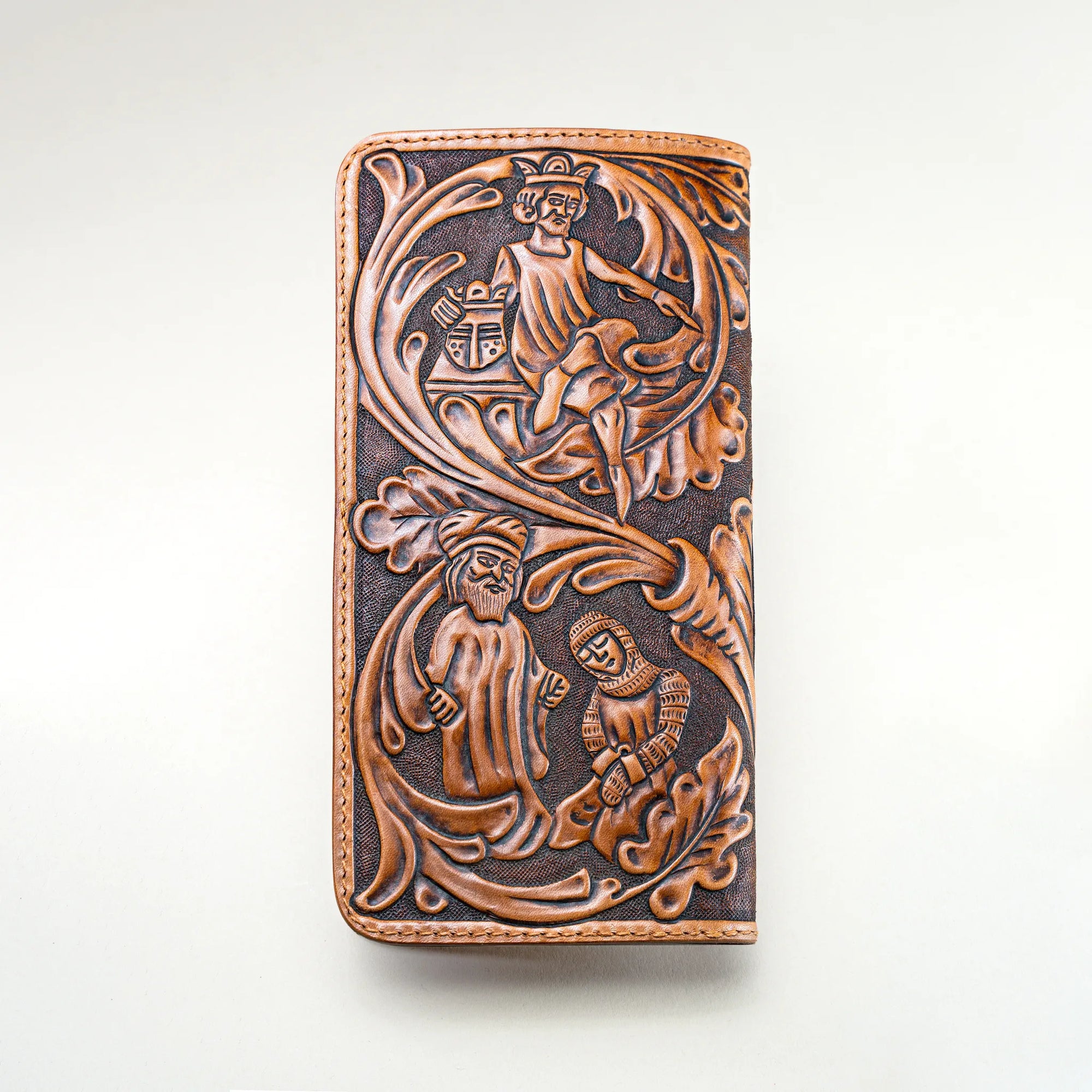 Reverse side of Huon de Bordeaux long wallet, hand-tooled with scenes inspired by medieval epics, crafted in Italian vegetable-tanned leather.