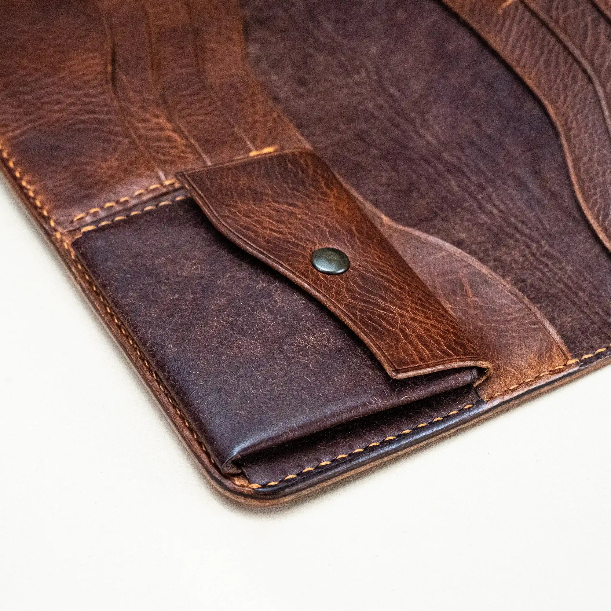 Close-up of coin pocket inside the Huon de Bordeaux long wallet, hand-stitched in Italian vegetable-tanned leather.
