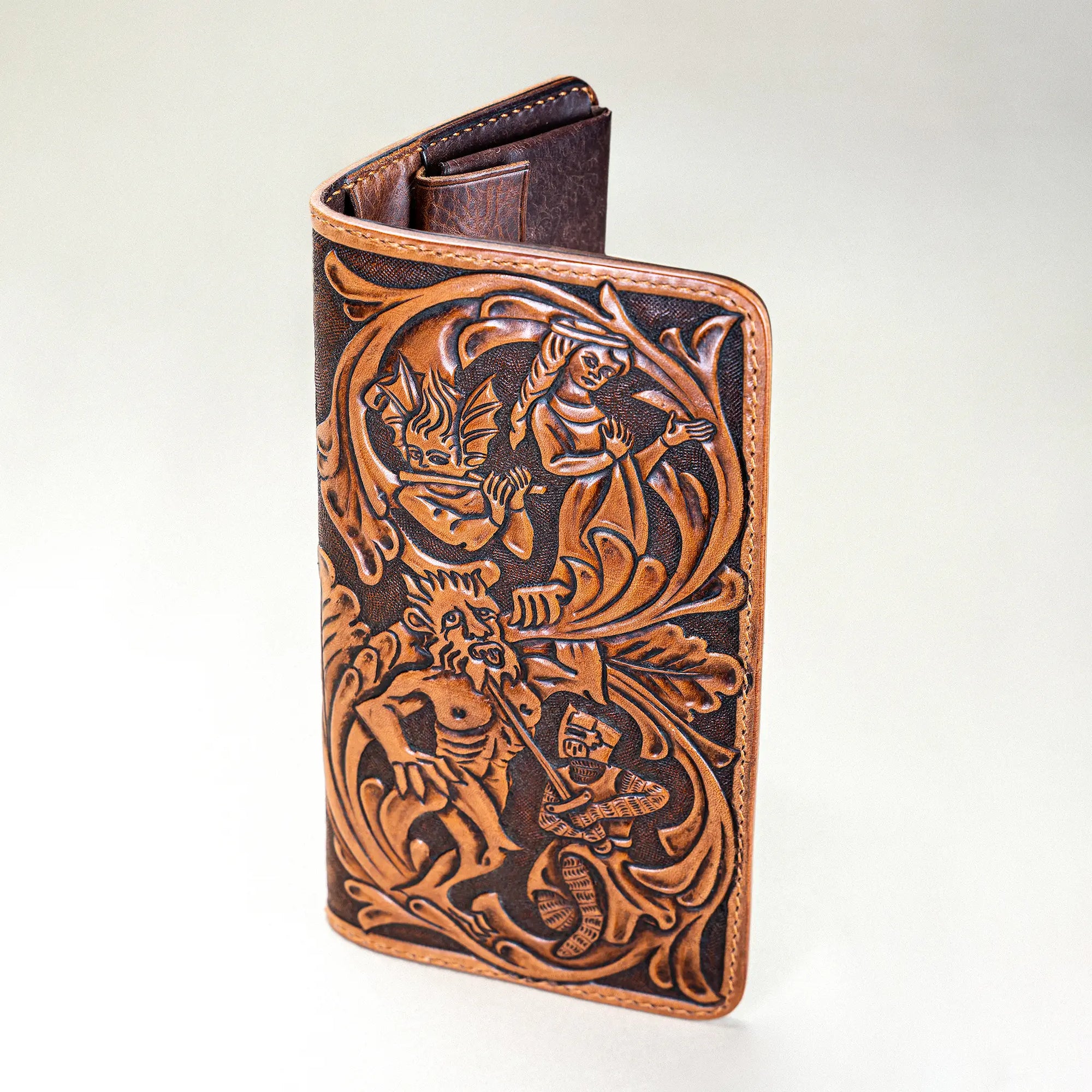 Angle view of Huon de Bordeaux hand-tooled long wallet, Italian leather with medieval epic-inspired tooling.