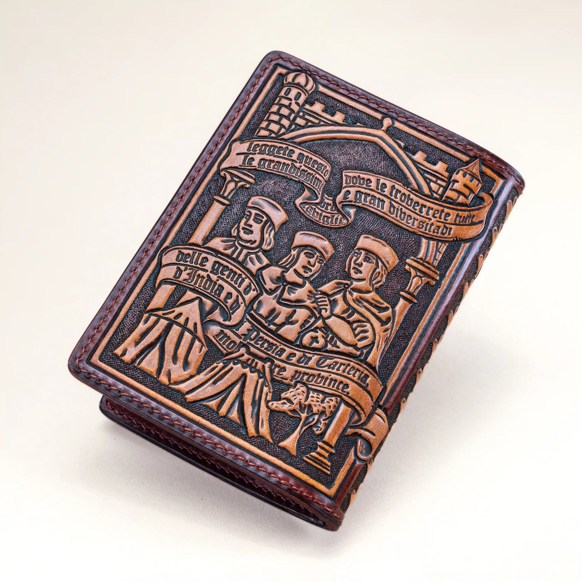 Leather passport wallet with hand-tooled scene of Marco Polo with his father and uncle, drawn from medieval manuscript illuminations of Il Milione.